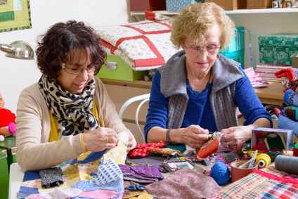 women working on a quilt