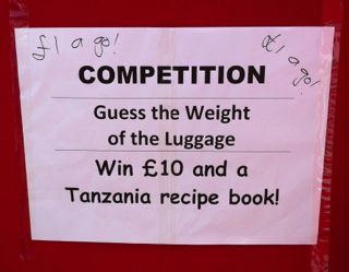 Guess the weight of the luggage poster